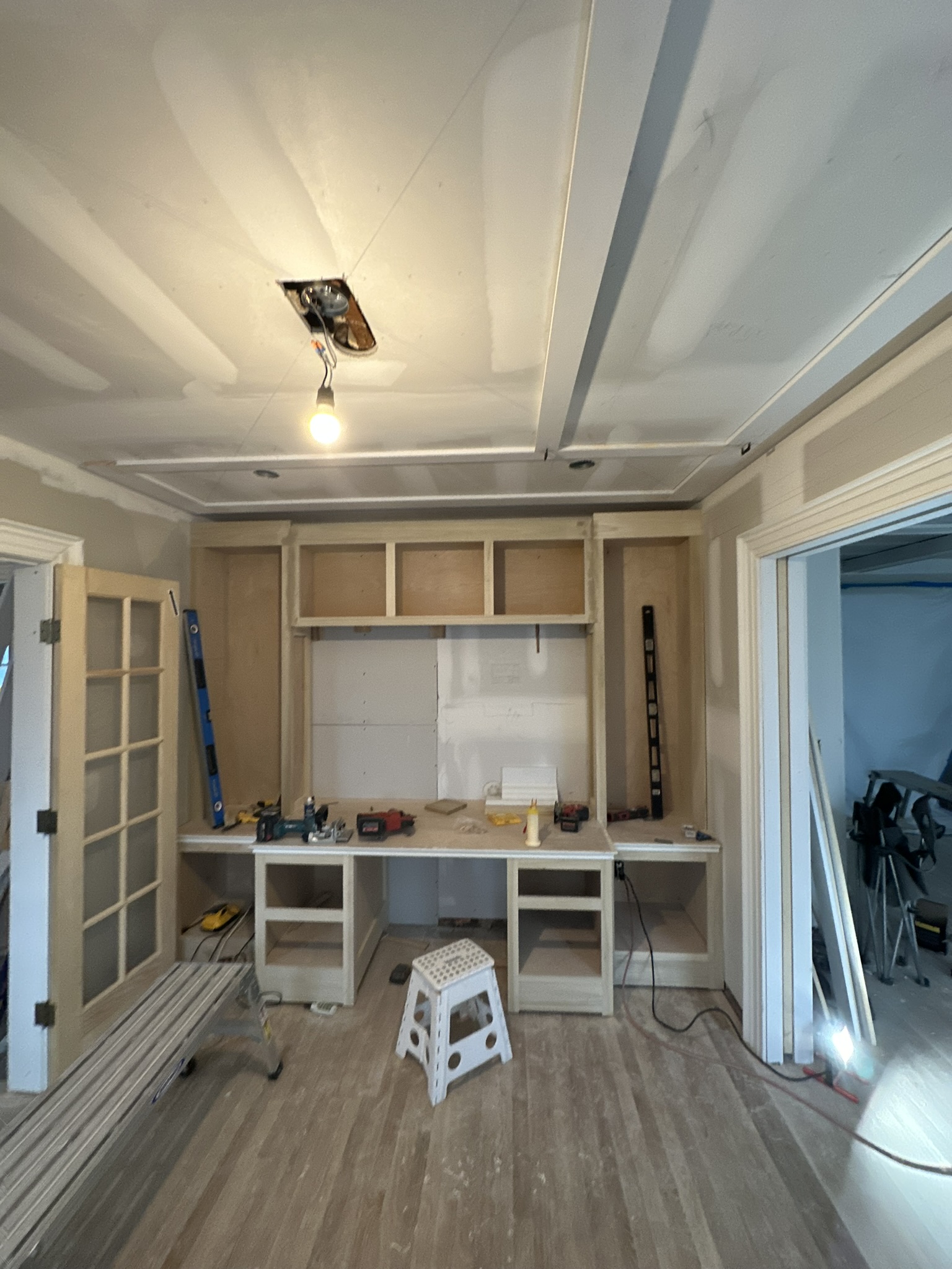 Built-in desk and coffered ceiling taking shape