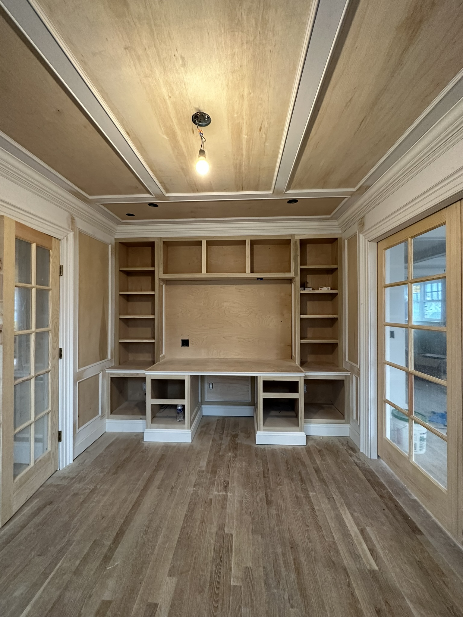 Unpainted custom home study ready for finishing